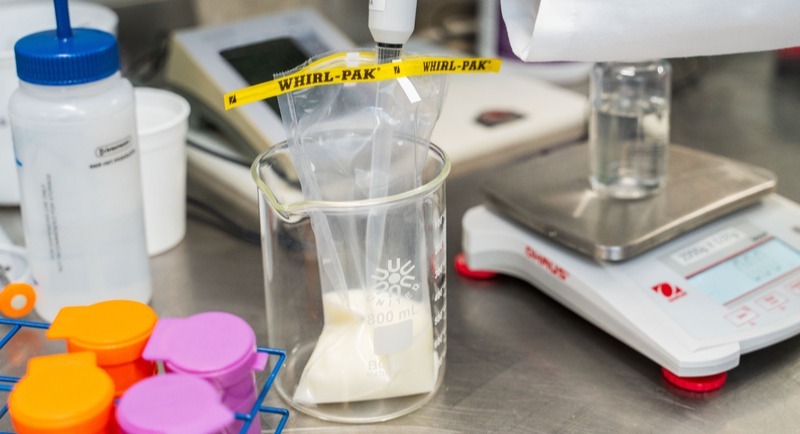 Diluting-a-milk-sample-from-a-whirl-pak-bag-close-up-horizontal-1-1