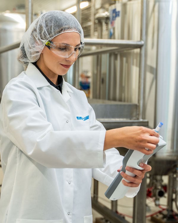 Jordyn-Warosh-inserting-test-swab-into-the-Neogen-LM1-Luminometer_WEB-1