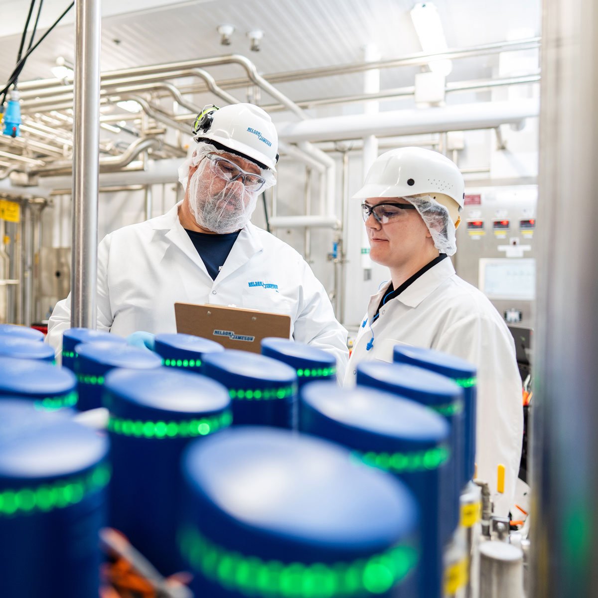 Nelson-Jameson-employee-and-customer-discussing-service-on-an-Alfa-Laval-ThinkTop-Valve-with-clipboard-1