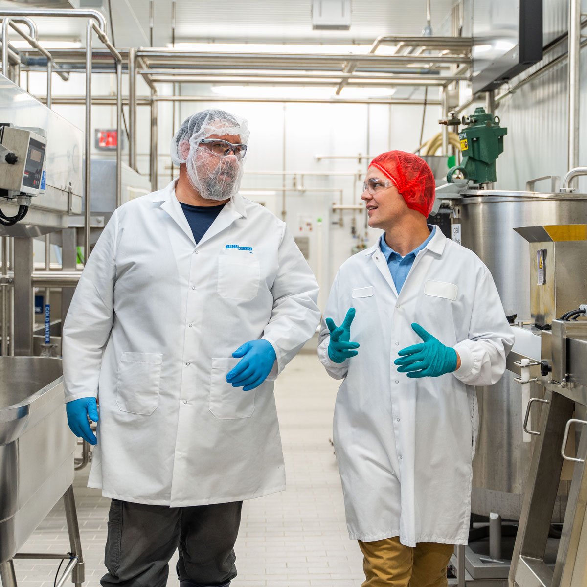 Nelson-Jameson-employee-and-customer-walking-and-talking